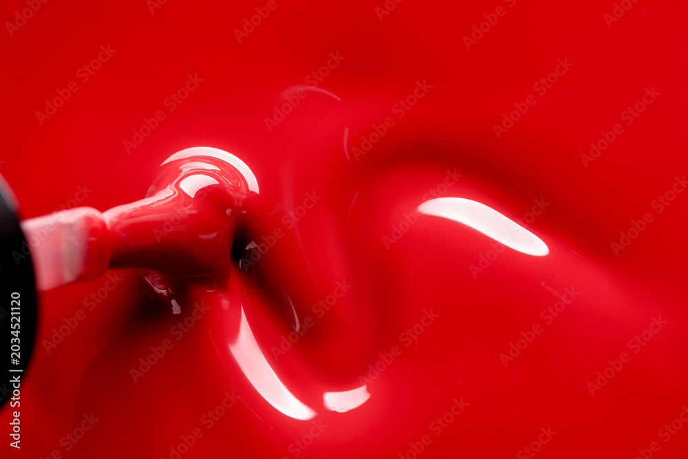 Obraz premium Red nail polish and brush as background, top view. Space for text