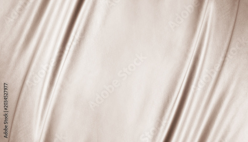 Light brown beige textile fabric. Elegant luxury background. Soft folds, curved lines. Nude pastel. Beauty branding fashion wedding. Premium cosmetic design. Empty template. Flat lay, table top view.