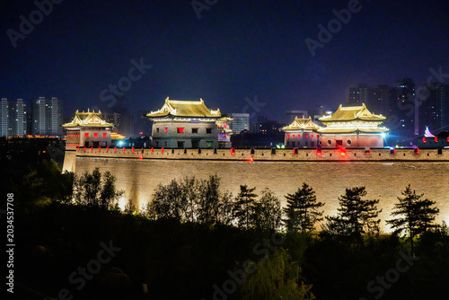 Illuminated ancient city wall and watchtowers of Datong, Shanxi, China