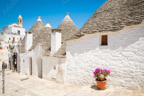 Beautiful old stone trulli houses with conical roofs in Alberobello, Puglia, Italy.