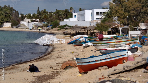 Cuadro en lienzo Colorful fishing boats and fishing nets on the beach in Hammamet, Tunisia