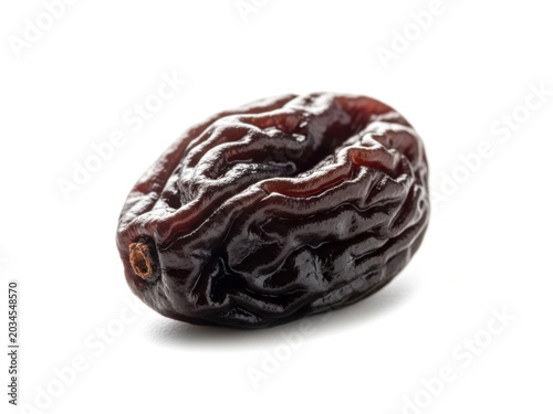 Close up of sweet dried black prune fruit isolated on white background for healthy organic snack nutrition