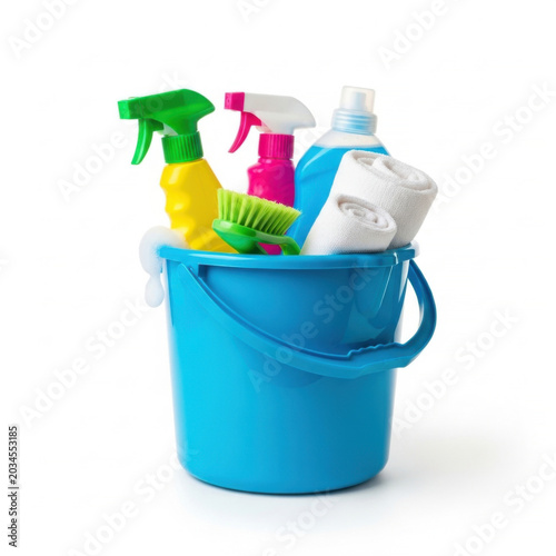 Blue plastic bucket filled with assorted household cleaning supplies bottles and sponges isolated on white background