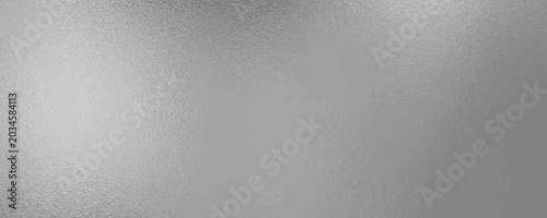 Foto Shiny silver foil metallic texture - glossy gray steel gleaming surface, frosted glass effect with blur glare reflection, bright polished metal material