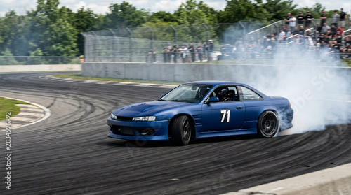 Exciting drifting racing cars on the circuit
