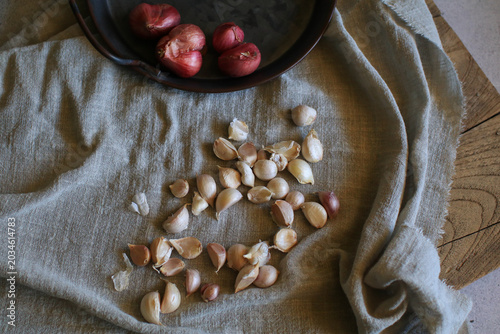 Garlic and red onion on fabric. Kitchen food ingredient concept. Healthy vegetables and medicine or herb.
 