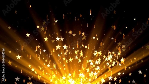 Golden starburst illuminates a dark background with scattered particles and bright light rays creating a celebratory atmosphere.