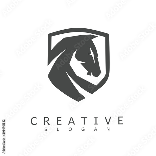 Bild auf Leinwand Strong horse head silhouette enclosed within a protective shield frame