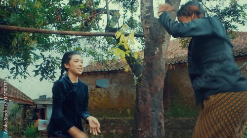 Happy Girls Laughing While Playing Skipping Game