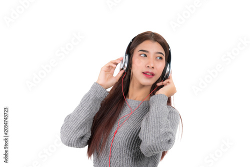 Beautiful Asian woman wearing headphones listening to music enjoying music entertainment isolated on white background.
