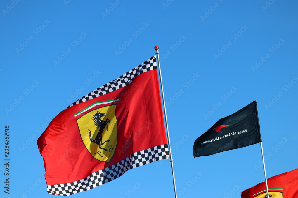 Obraz premium 22 May 2026, Montreal, Canada: Ferrari flags wave above Formula 1 fans at Grand Prix weekend. g.
