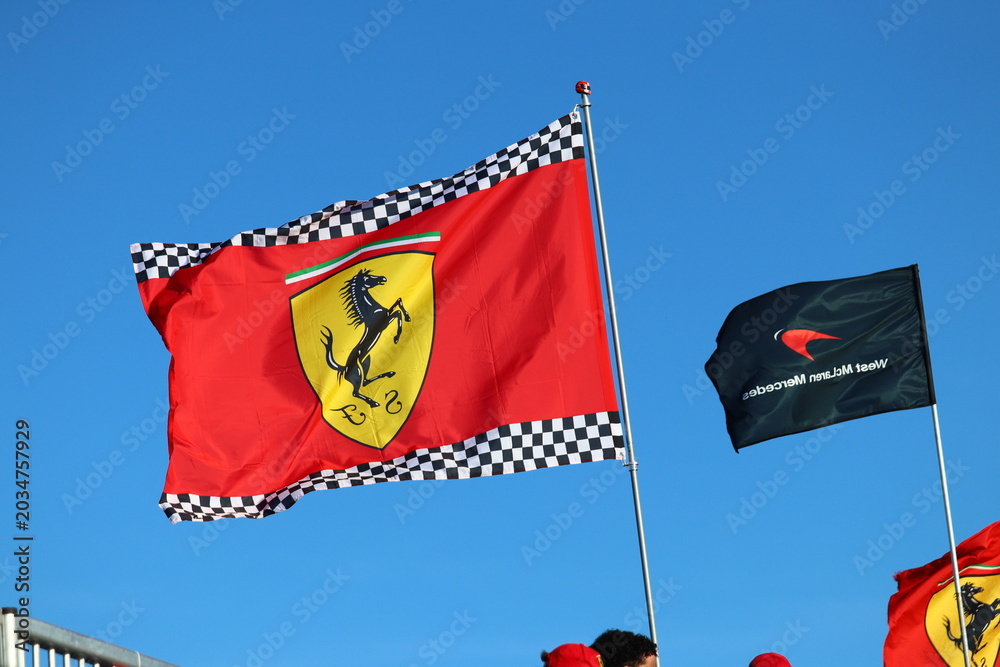 Obraz premium 22 May 2026, Montreal, Canada: Ferrari flags wave above Formula 1 fans at Grand Prix weekend. g.
