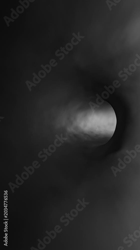 Endless black and white smoke texture tunnel loop motion vertical background.