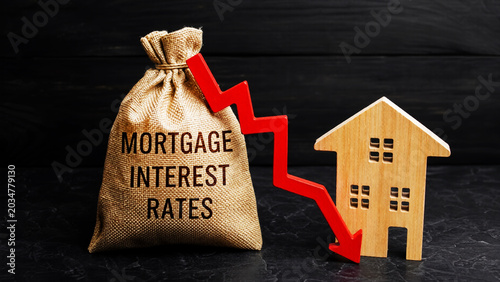 Mortgage Interest Rates Decline Concept with Falling Financial Graph and Wooden House Investment Background