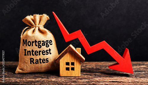 Mortgage Interest Rates Decrease Concept with Falling Financial Arrow and Wooden House Investment Background