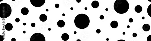 Abstract black polka dot pattern on a white background. Minimalist geometric random circles texture element for modern horizontal banner decoration.