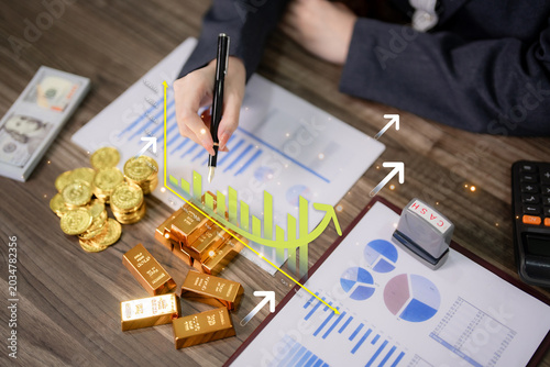 investment analysis financial planning businessman analyzing market growth chart with gold bars coins asset management wealth portfolio trading stock report