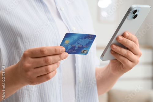 Woman with credit card and ...