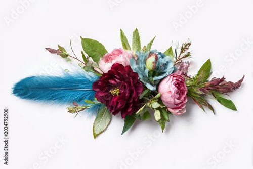 Burgundy pink and teal floral arrangement with greenery isolated on white background