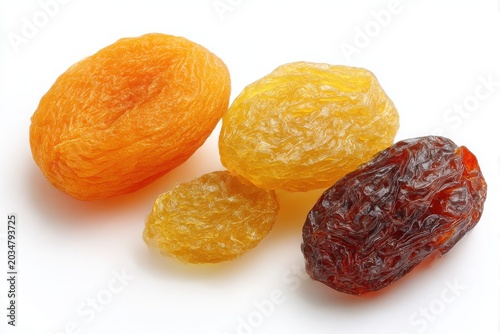 Close-up of delicious dried apricots and raisins isolated on white studio background white background