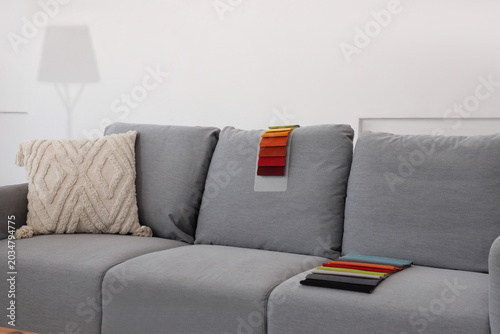 Grey sofa with fabric sampl...