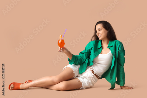 Young woman with aperol spr...