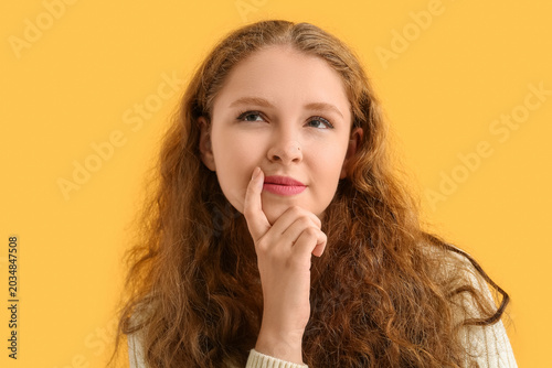 Portrait of thoughtful redh...