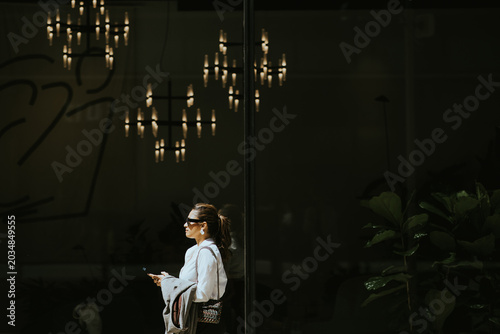 Walking near modern lights ...