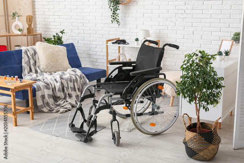 Modern empty wheelchair in ...