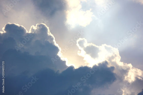 sun rays breaking though the cumulonimbus clouds,painting the sky with hope wonder