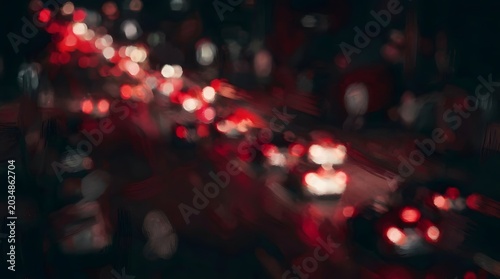 Blurred night traffic lights on a city street, long exposure of car headlights and taillights in dark urban environment