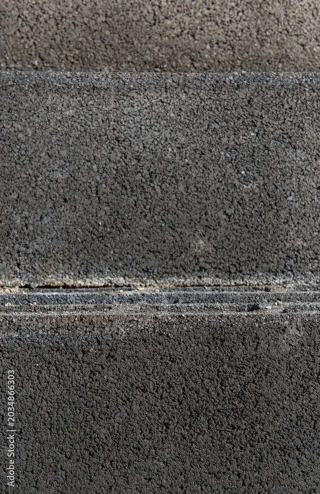 Fototapeta premium Concrete block wall surface with mortar joints for construction work.