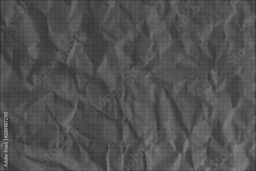 Фотография A close-up view of crumpled gray paper with many wrinkles
