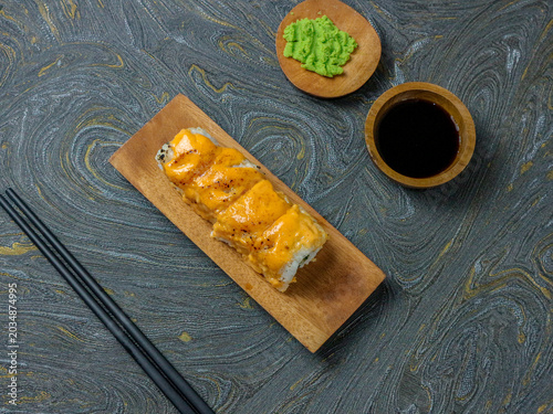 Fresh Sushi Roll with Spicy Mayo on Wooden Board in Minimal Tray