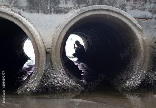 Engineers are inspecting and reporting data on the industrial wastewater treatment tunnel.