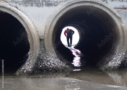 Engineers are inspecting and reporting data on the industrial wastewater treatment tunnel.