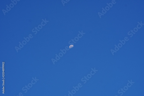 Photos A Small White Cloud Floats in a Vast Clear Blue Sky During Daytime