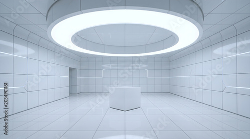 Display pedestal stands in the center of a sterile futuristic room illuminated by a large circular light fixture mounted on the ceiling above polished white floor tiles and reflective wall surfaces.