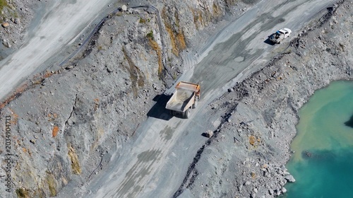 Fotografía Aerial View of Mining Trucks Navigating a Gold Coast Quarry Road