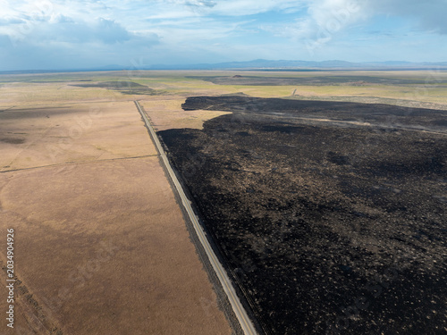 Burnt earth meets healthy soil in this striking aerial shot