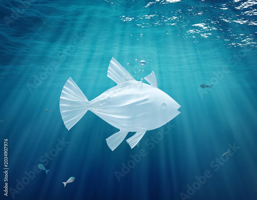 Ocean waste and ecology concept with plastic fish shape
