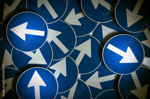Foto ROAD SIGNS POINTING IN DIFFERENT DIRECTIONS - CONCEPT OF INDECISION, CONFUSION A