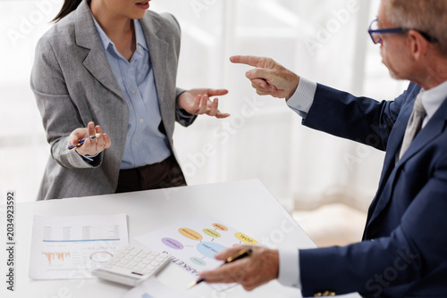 Fotografie Business people engaging in a heated workplace disagreement