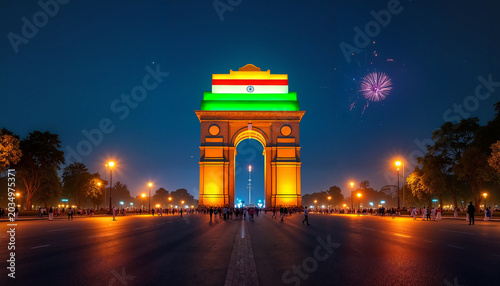 Illuminated India Gate with tricolor lights at night, festive celebration
