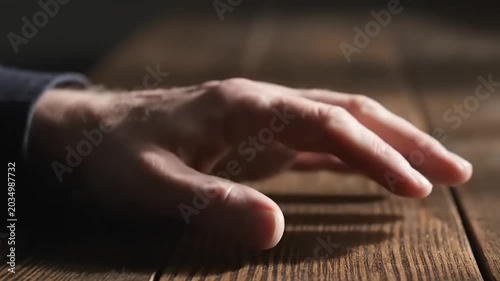 Hand gestures on a wooden table, expressing emotions and feelings.