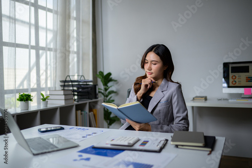 Woman working from home reviewing financial data