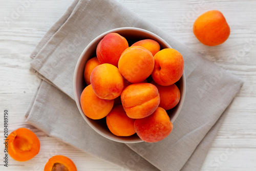 Raw Organic Apricots in a Bowl, top view. Flat lay, overhead, from above.