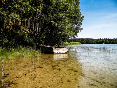 Photos Boat on Wdzydzkie lake coast.