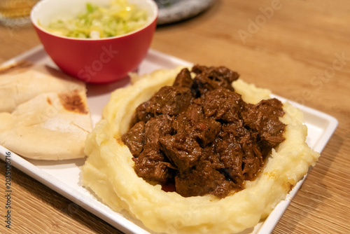 Billede på lærred Eastern European goulash beef stew served with an artful mashed potato presentat