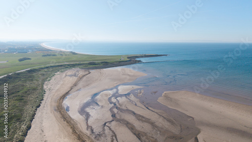 Obraz na plátně Aerial view of a wide sandy beach at low tide